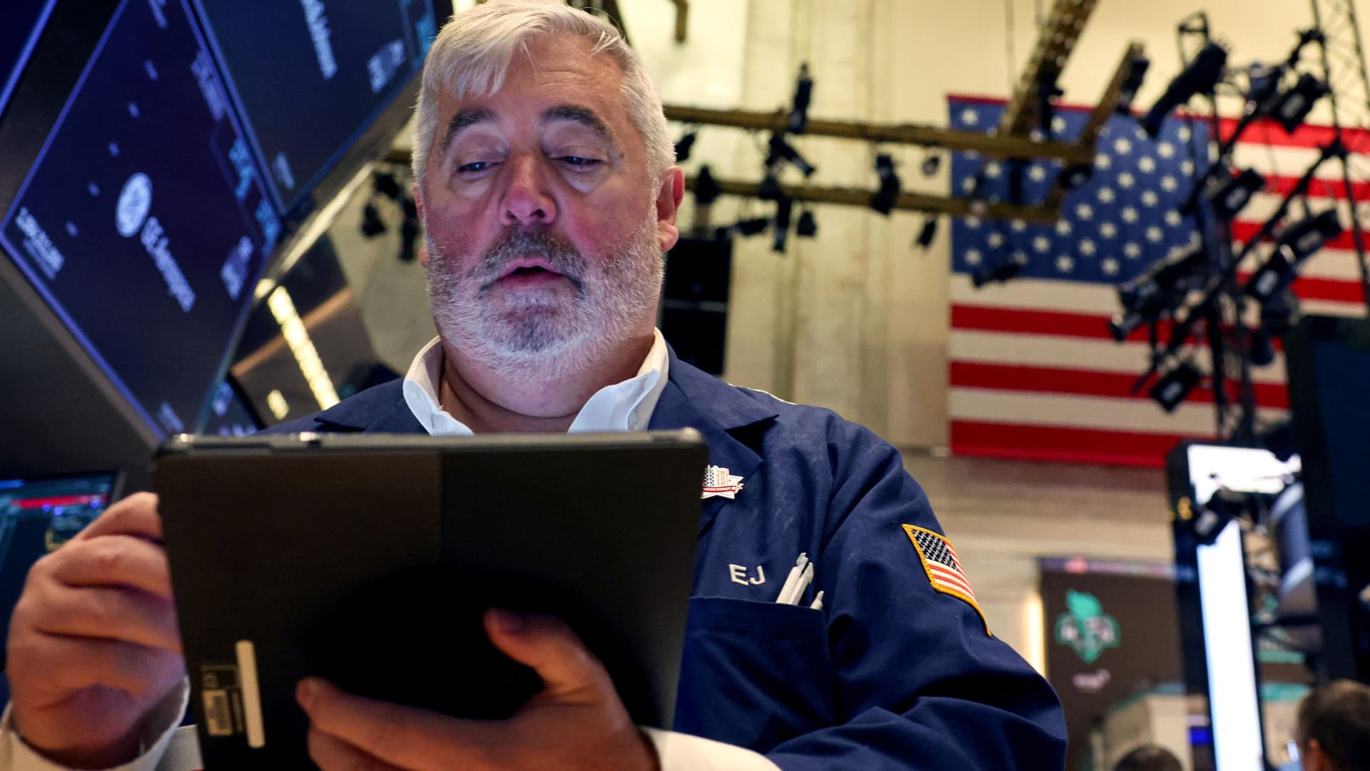 A specialist trader works inside a post on the floor at the New York Stock Exchange on Oct. 23, 2024.