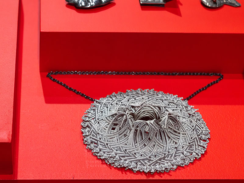 Lauren Tickle (United States, b. 1985), $360 US Dollars Currency Converted Pendant, 2014US currency, silver, monofilament, 4 3/4 x 5 3/4 x 1 3/4 inches (121 x 146 x 44 mm), Museum of Arts and Design, New York; gift of the Ron Porter and Joe Price Collection, 2022, shown in OUT of the Jewelry Box, Museum of Arts and Design, New York (April 20, 2024–April 12, 2026), photo: Jenna Bascom, courtesy of the Museum of Arts and Design 