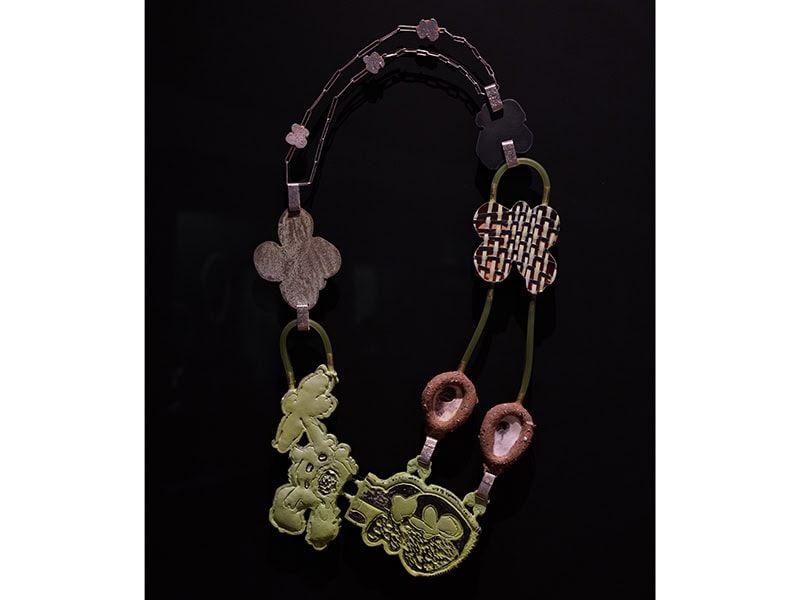 Sulo Bee (United States, b. 1993), B3TT3R_dayz [P4LM_TR33_angel], 2023, brass, copper, fine silver, sterling silver, steel, epoxy, enamel paint, rubber, Caspar Beach sand, found seashells, 26 x 18 x 2 inches (660 x 457 x 51 mm), Museum of Arts and Design, New York; purchase with funds provided by the Collections Committee, 2023, shown in OUT of the Jewelry Box, Museum of Arts and Design, New York (April 20, 2024–April 12, 2026), photo: Jenna Bascom, courtesy of the Museum of Arts and Design