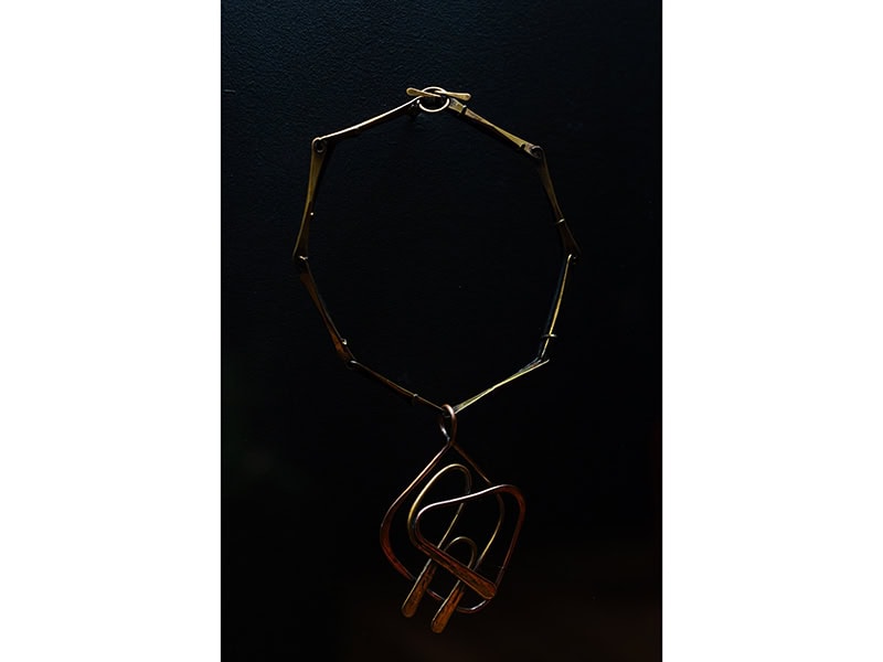 Art Smith (Cuba, 1917–1982), Untitled (Neckpiece), c. 1950, brass, 8 3/4 x 5 1/2 x 1/2 inches (222 x 140 x 13 mm), Museum of Arts and Design, New York, gift of Bunny Shulman, 2009, shown in OUT of the Jewelry Box, Museum of Arts and Design, New York (April 20, 2024–April 12, 2026), photo: Jenna Bascom, courtesy of the Museum of Arts and Design