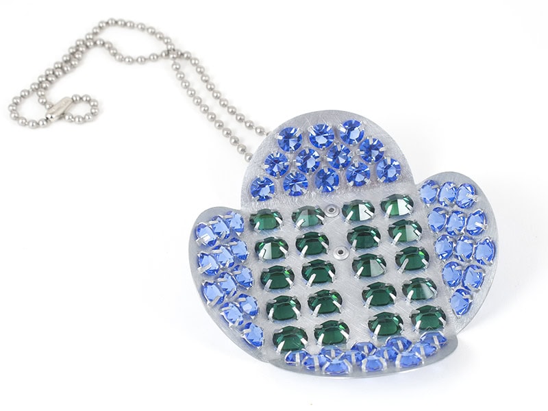 Everett Hoffman, blue and green flower (Necklace), 2022, vintage rhinestones, zinc, stainless steel, 3 ½ x 3 ½ x 1 ½ inches (89 x 89 x 38 mm), photo courtesy of the artist