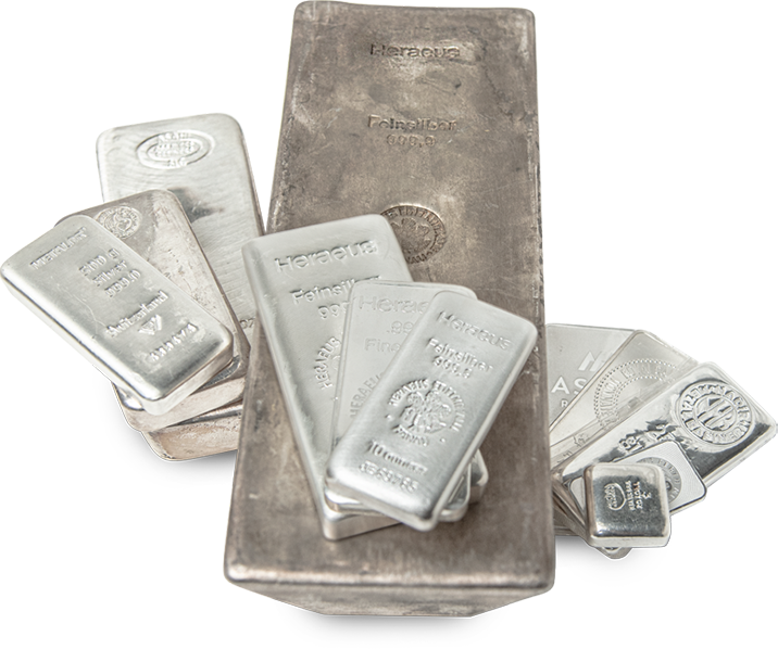 Assorted silver bullion bars, including large and small sizes, engraved with purity and branding details, ideal for investment purposes.