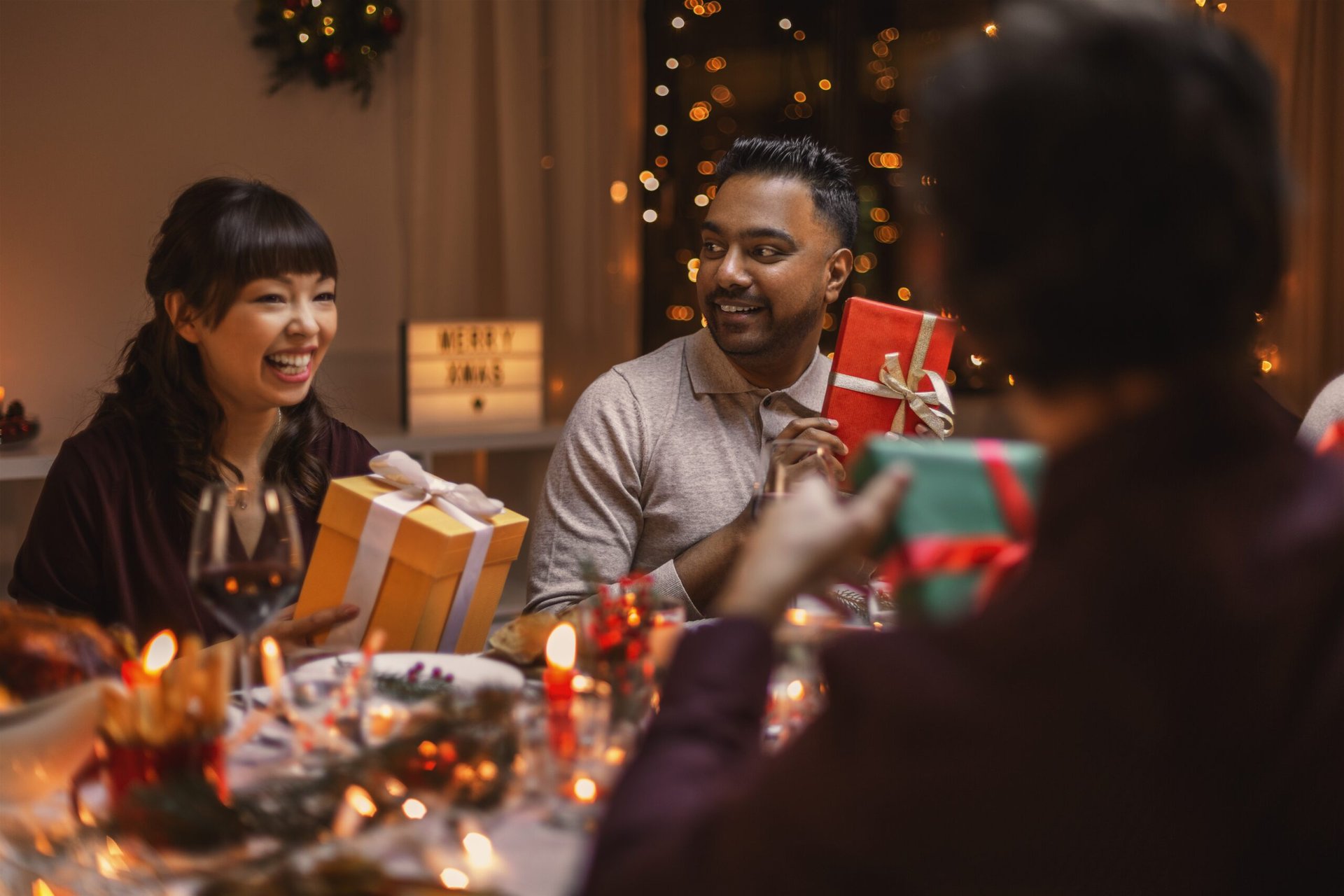 Friends exchanging gifts at a holiday party