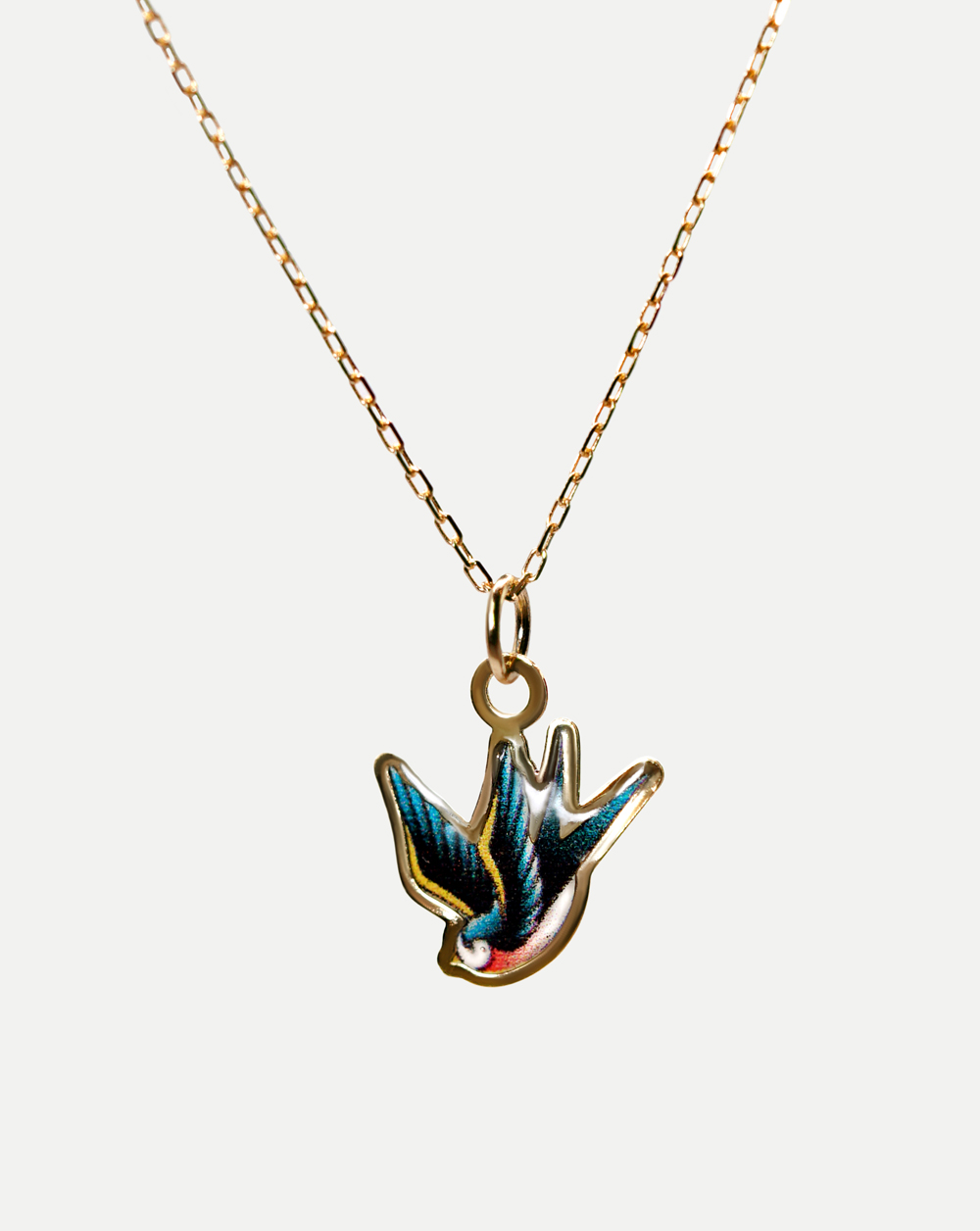 swallow bird pendant 9k solid gold necklace tattoo style mel mellis affordable gold jewellery uk brand